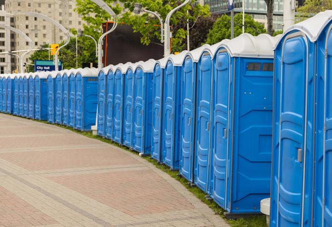 a line of portable restrooms set up for a wedding or special event, ensuring guests have access to comfortable and clean facilities throughout the duration of the celebration in Manchester CT